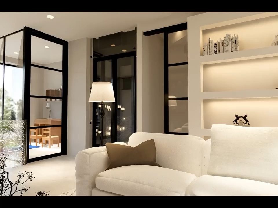 Cream sofa and black-framed glass doors living space